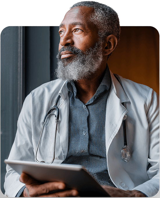 Medical professional using a tablet, representing specialized care for uveal melanoma treatment